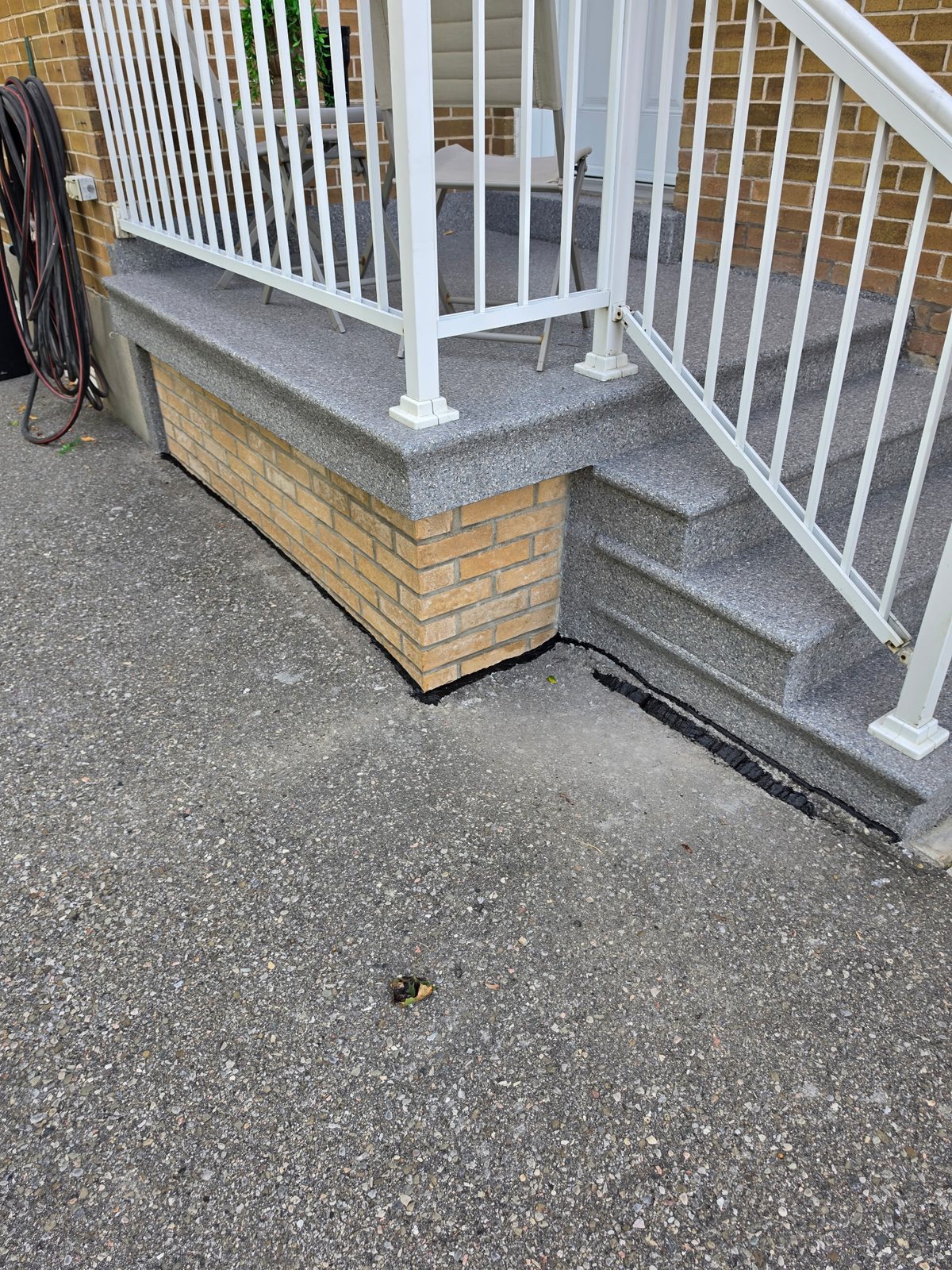 A Toronto porch and steps resurfaced and finished before the season turned