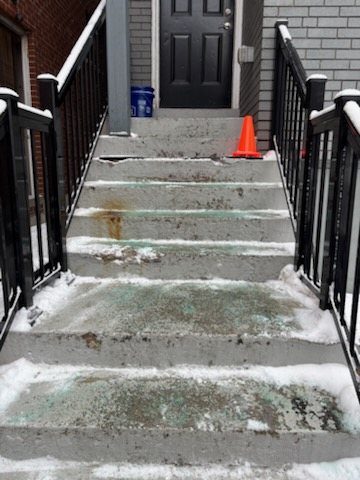 The same Toronto front steps before the restoration, worn and salt-eaten