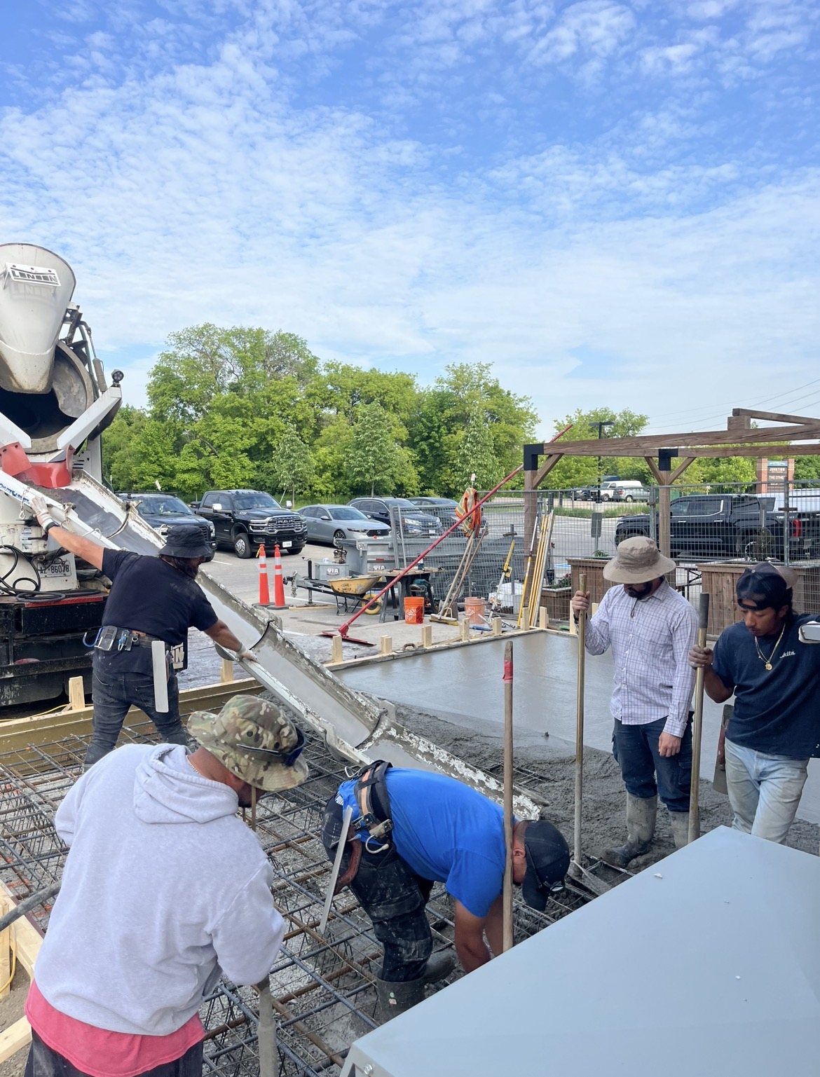 The Concrete Repair Plus crew placing concrete from the chute on a North York commercial pad