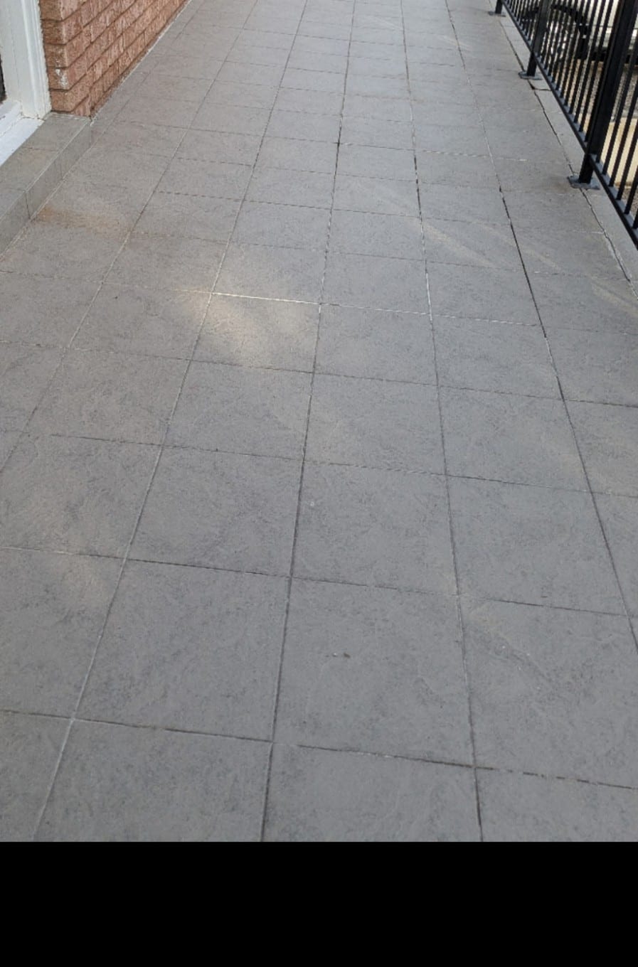 Old tiles and adhesive on a North York staircase before removal