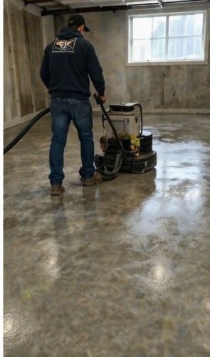 Concrete Repair Plus technician operating a planetary grinder while diamond-polishing a concrete floor in a Toronto commercial basement